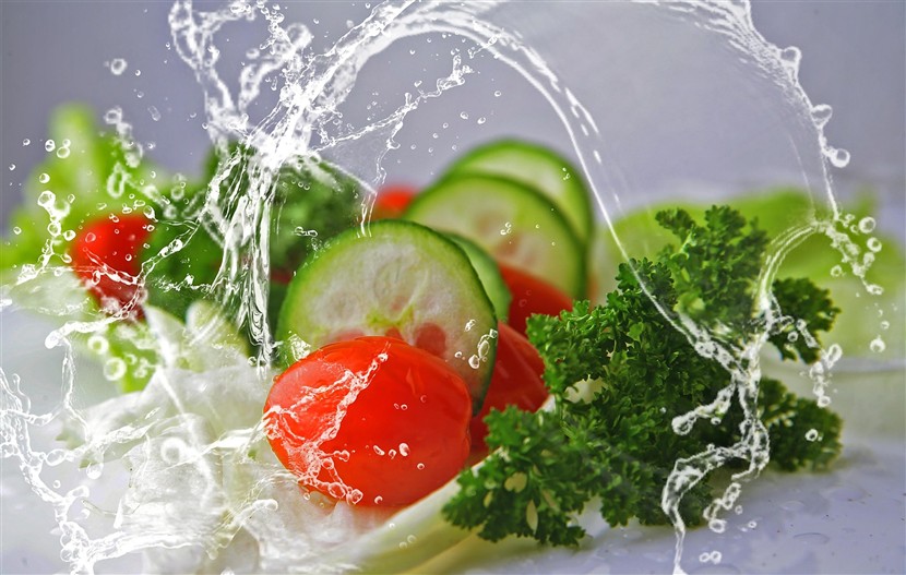 water splashing water on a salad